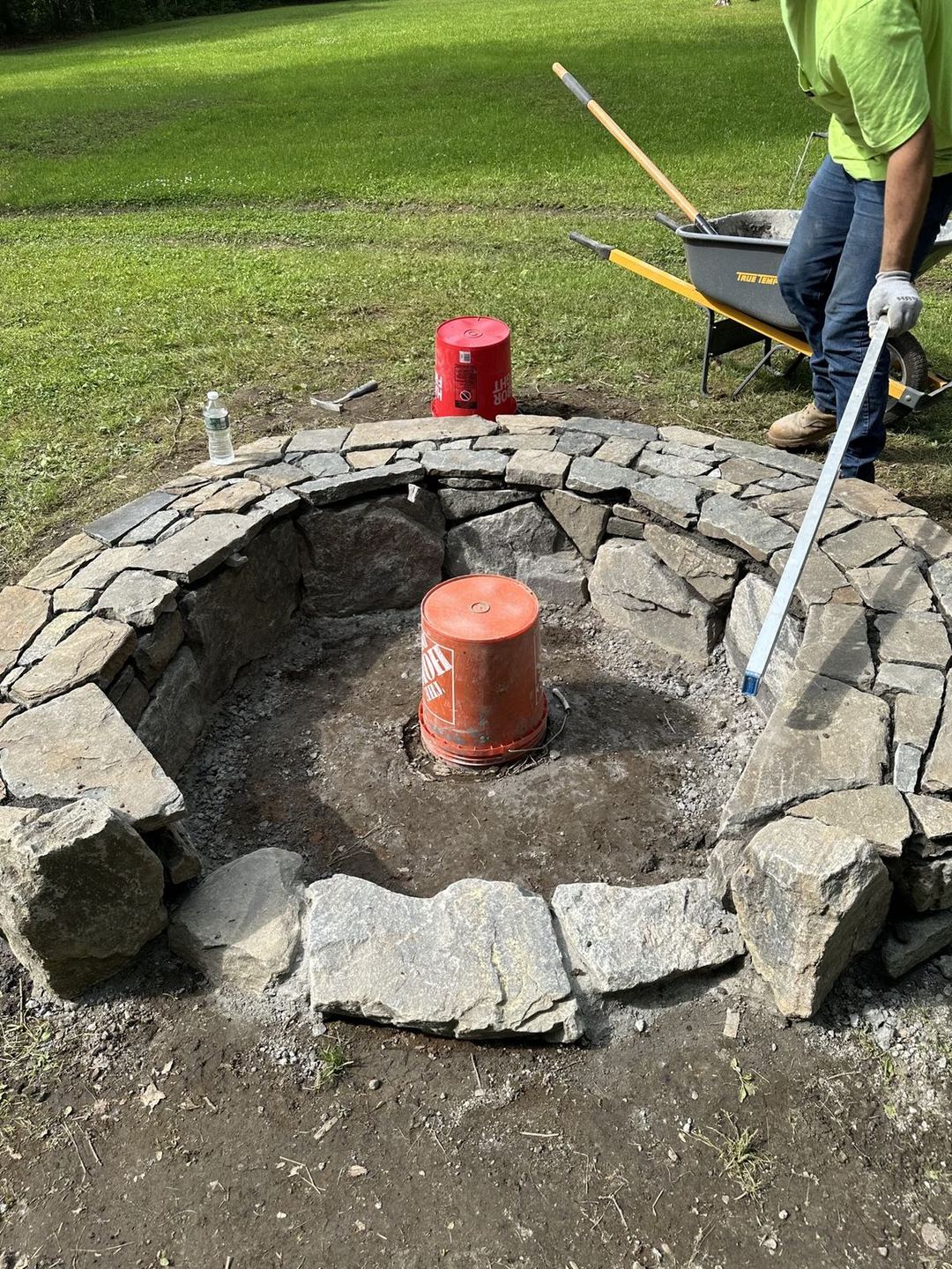 Stone fire pit under construction